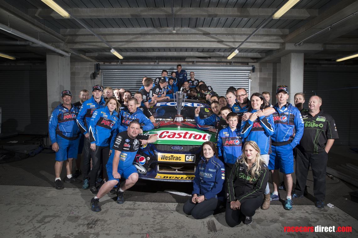 The winning team, car and trophy