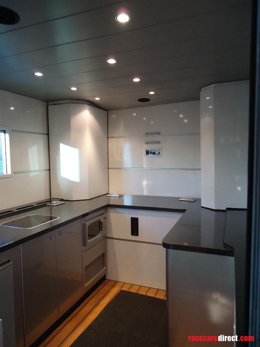 two-formula-car-or-hospitality-transporter