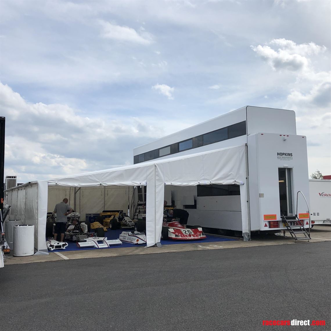 two-formula-car-or-hospitality-transporter