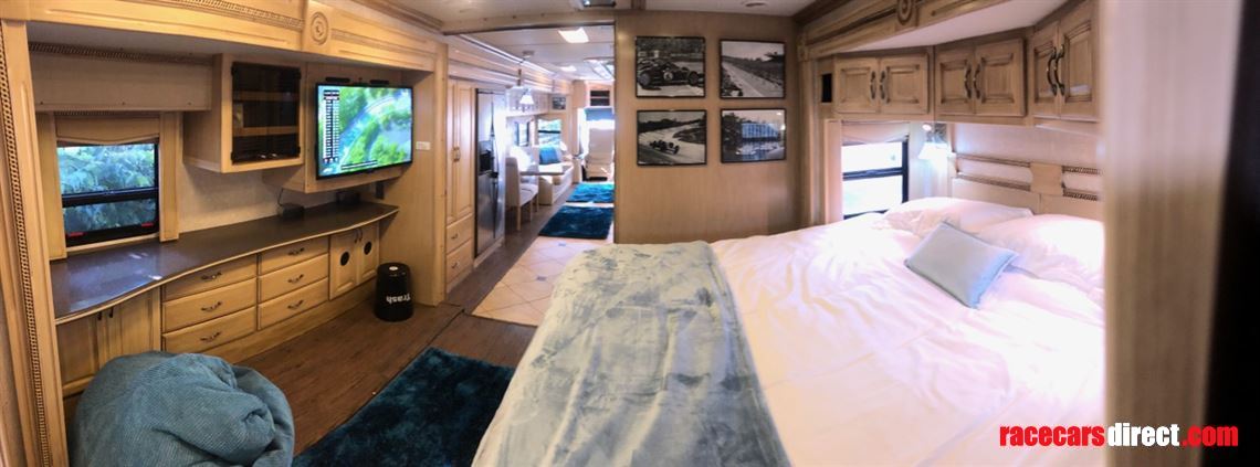 Huge bedroom with TV and loads of storage