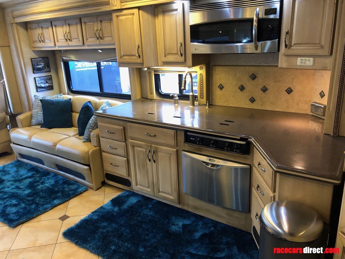 Kitchen area with microwave / oven, and dishwasher