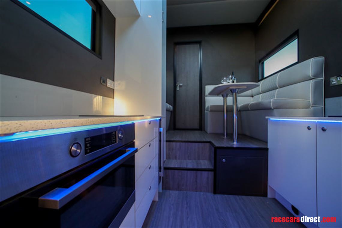 custom-built-tri-axel-step-trailer-with-luxur