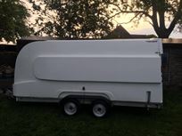 formula-race-pod-covered-car-transport-traile