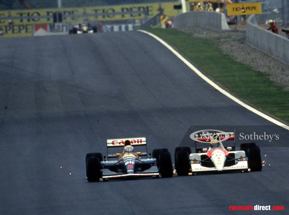 Nigel Mansell in his Williams FW14 battles wheel to wheel with Ayrton Senna in his McLaren MP4/6 to lead the 1991 Spanish Grand Prix. Courtesy of the Girardo & Co. Archive