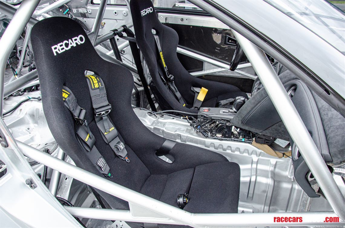 A large roll cage with connection to the axle has been welded in.