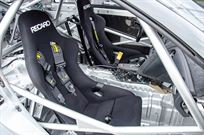 A large roll cage with connection to the axle has been welded in.