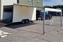 covered-tilt-bed-trailer-with-awning