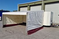 covered-tilt-bed-trailer-with-awning