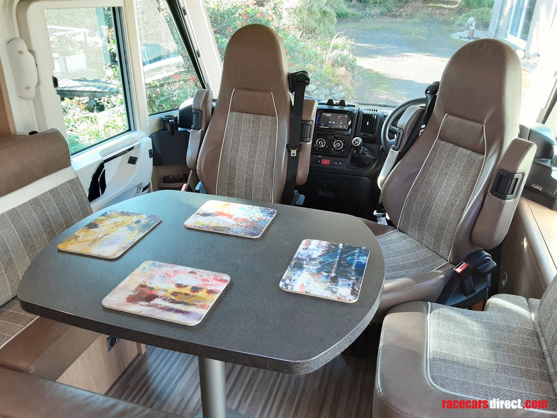 Table with swivel Captain chairs