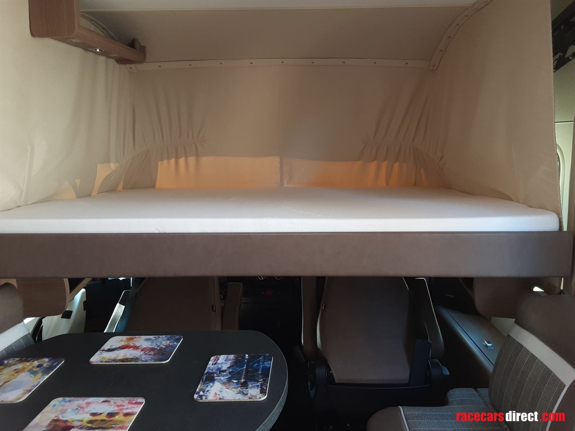 Front drop down double bed 