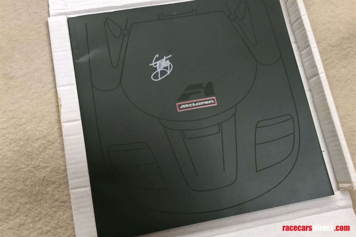 mclaren-f1-softback-launch-brochure-hand-sign