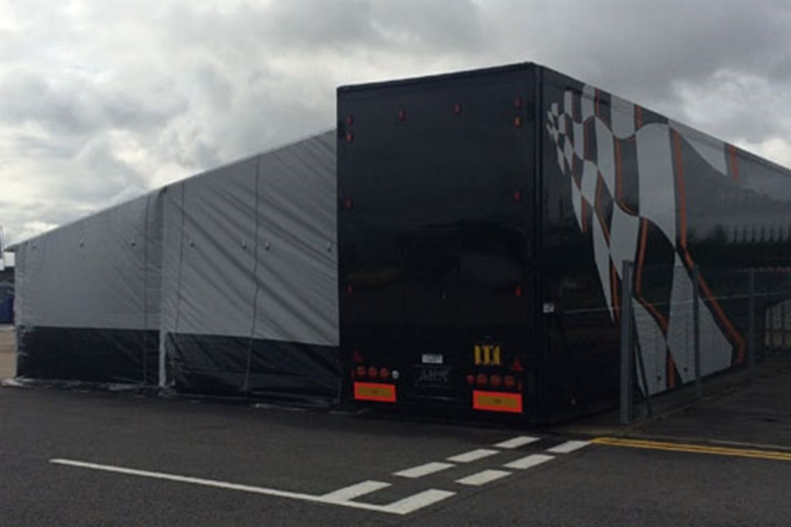 Race car transporter with full size awning, kitchen & Storage