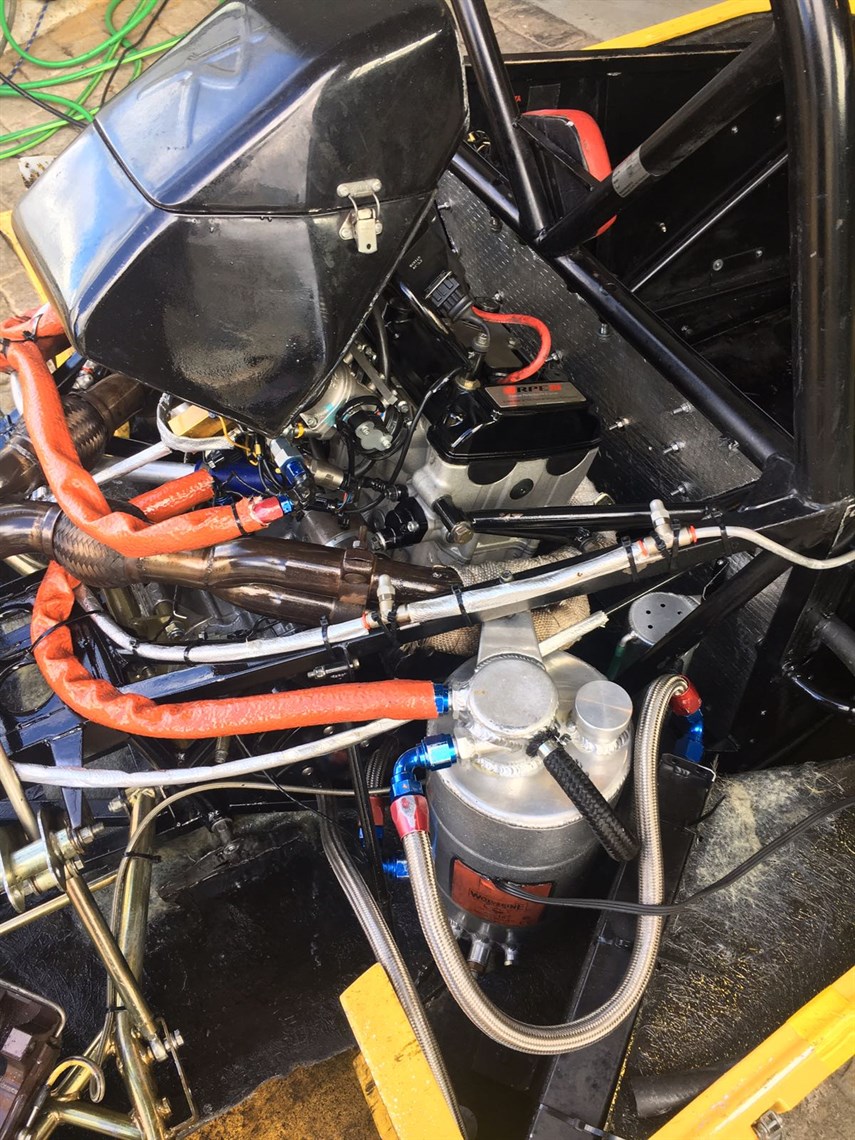 1340cc Radical Seald Engine with the heat wrap on the exhaust and heat sleeves on the oil and fuel